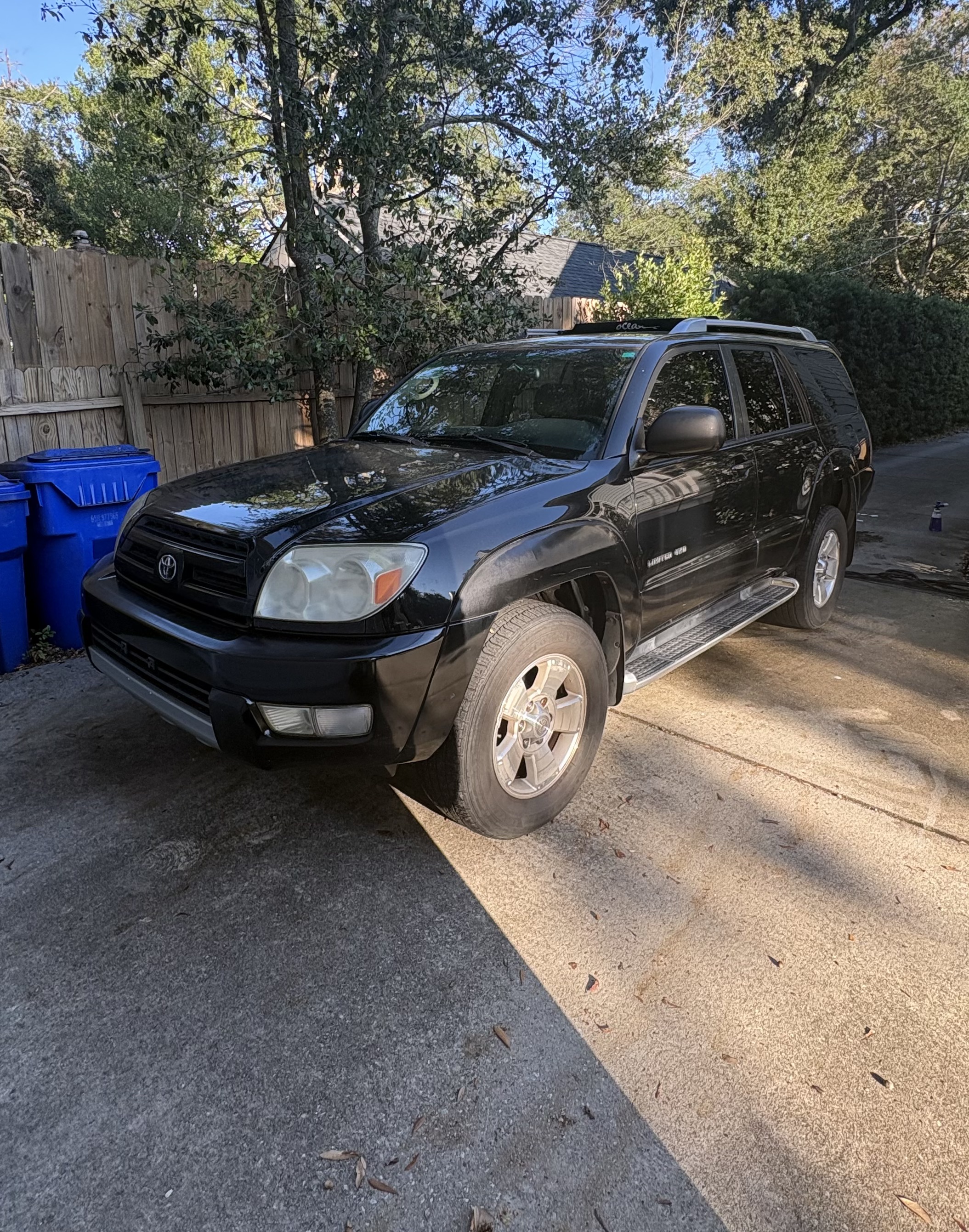 Glossy black SUV after exterior detail